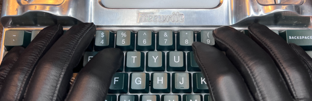 Gloved hands on keyboard