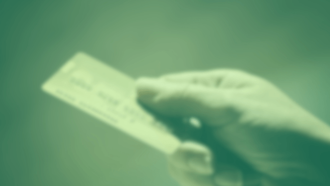 Close-up of a hand holding a credit card