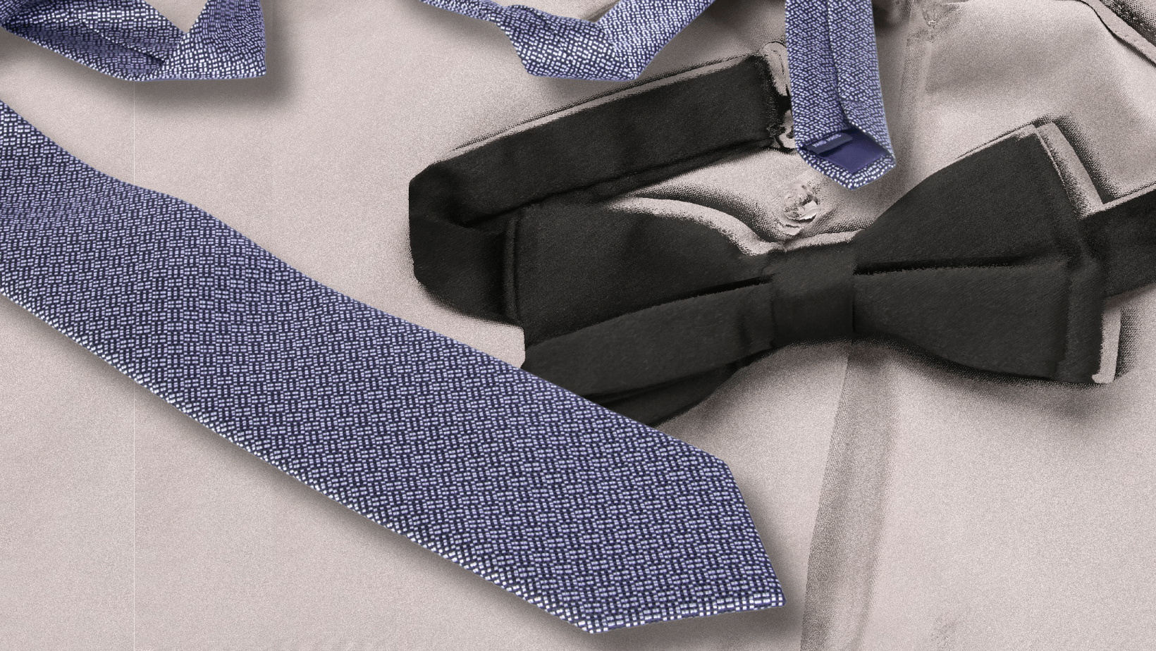 A close-up of a formal clothing ensemble featuring a textured dark blue tie, a black bow tie, and parts of a gray dress shirt. The ties contrast with the smooth fabric of the shirt.