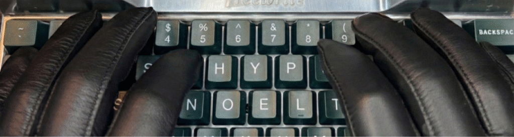Jay Hypno's gloved hands on a keyboard but the letters read HYPNOEL