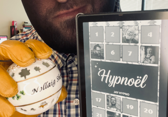 Jay Hypno wearing tan gloves holds a decorative ornament and a Kindle displaying a digital book titled Hypnoël.